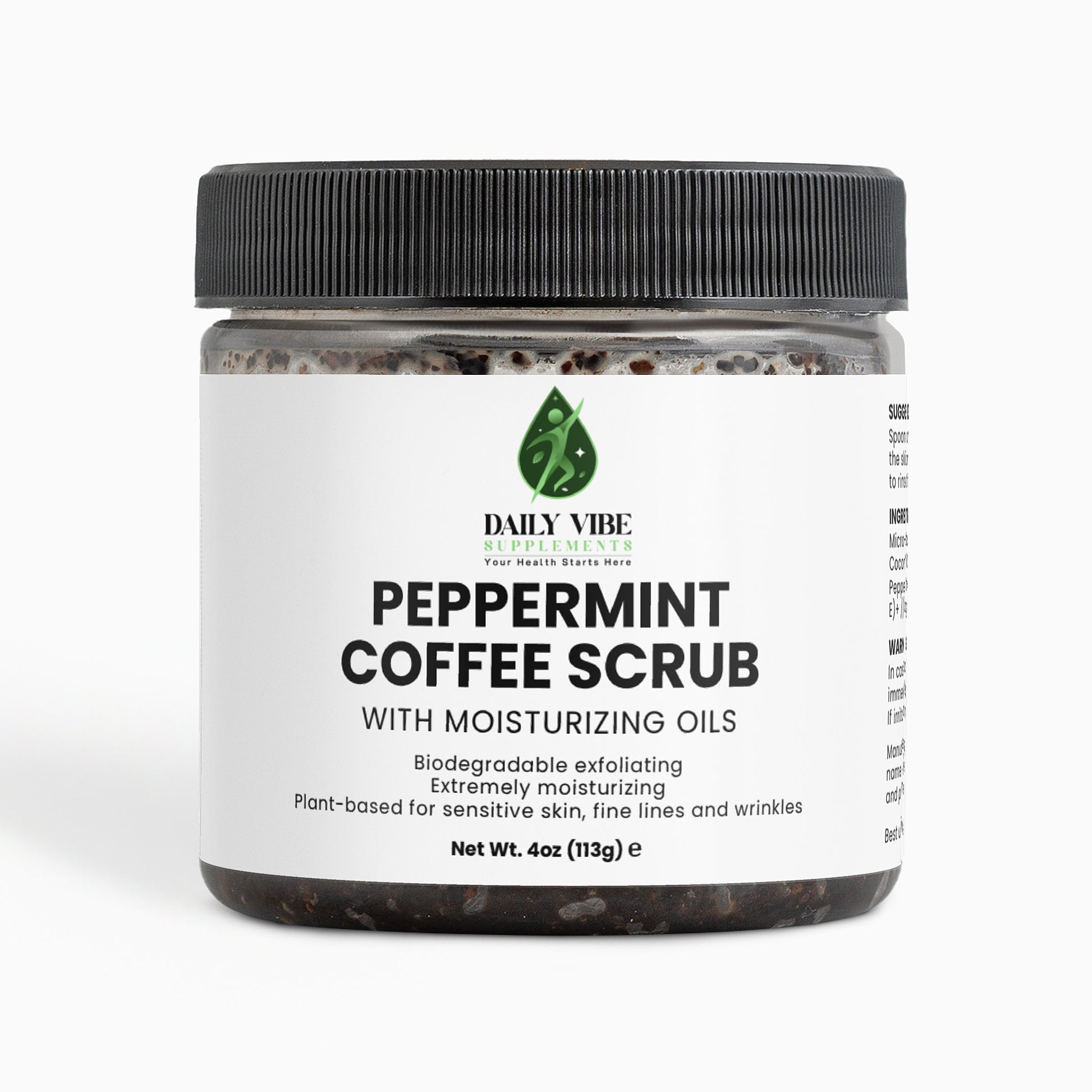 Jar of peppermint coffee scrub with a black lid on a white background